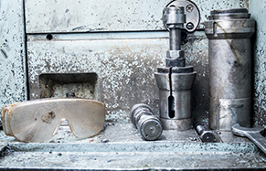 Industrial scene with pipes and safety goggles
