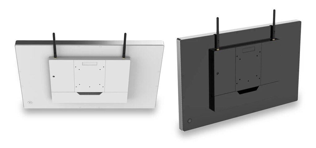 Two TM-6140, one white and one black, with two black plastic antennas sticking up from the back of the computers.