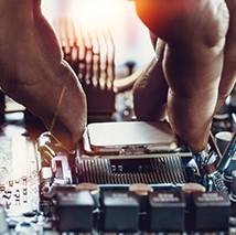 Hand installing a CPU into a motherboard