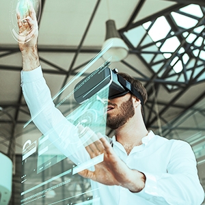 Man wearing VR headset uses a virtual interface