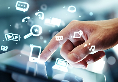 Hand touching a touchscreen as icons explode from the device