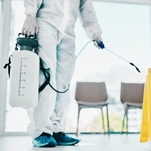 Agent in protective coating sprays down a clean room