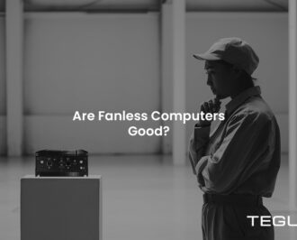 Black and white scene of a woman examining a fanless computer on a pedestal with the text Are Fanless Computers Good?