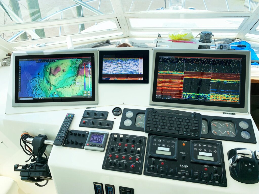 Computer controls on a boat, including a Teguar monitor.