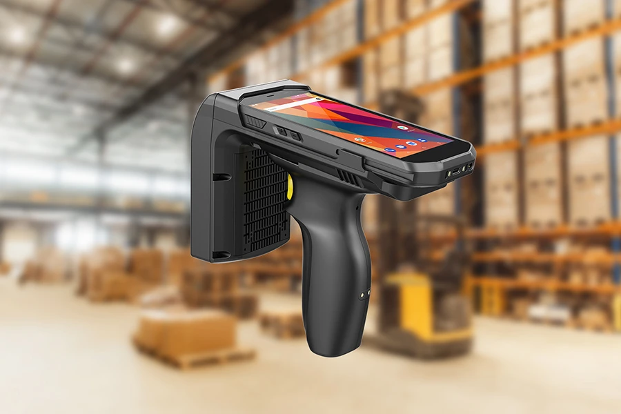 A handheld barcode scanner in a warehouse.