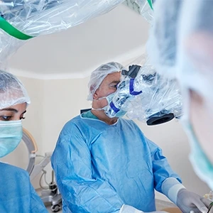 Two surgeons using a robotic surgery machine