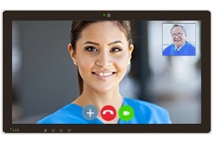 A medical professional holding a telehealth appointment with a patient on a tablet device